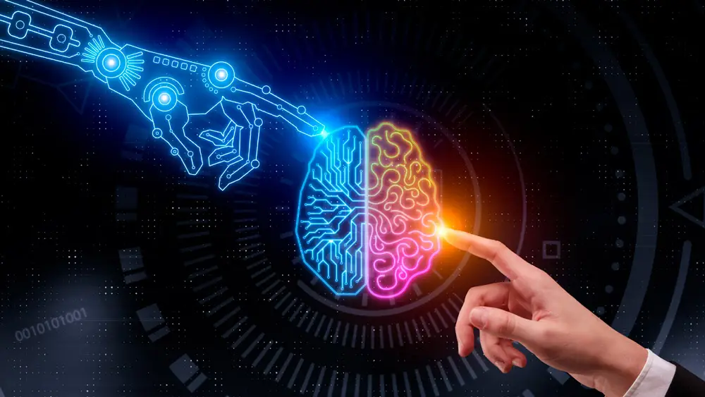 M&atilde;o humana conectada a uma m&atilde;o rob&ocirc; mostrando que &eacute; poss&iacute;vel conversar com intelig&ecirc;ncia artificial